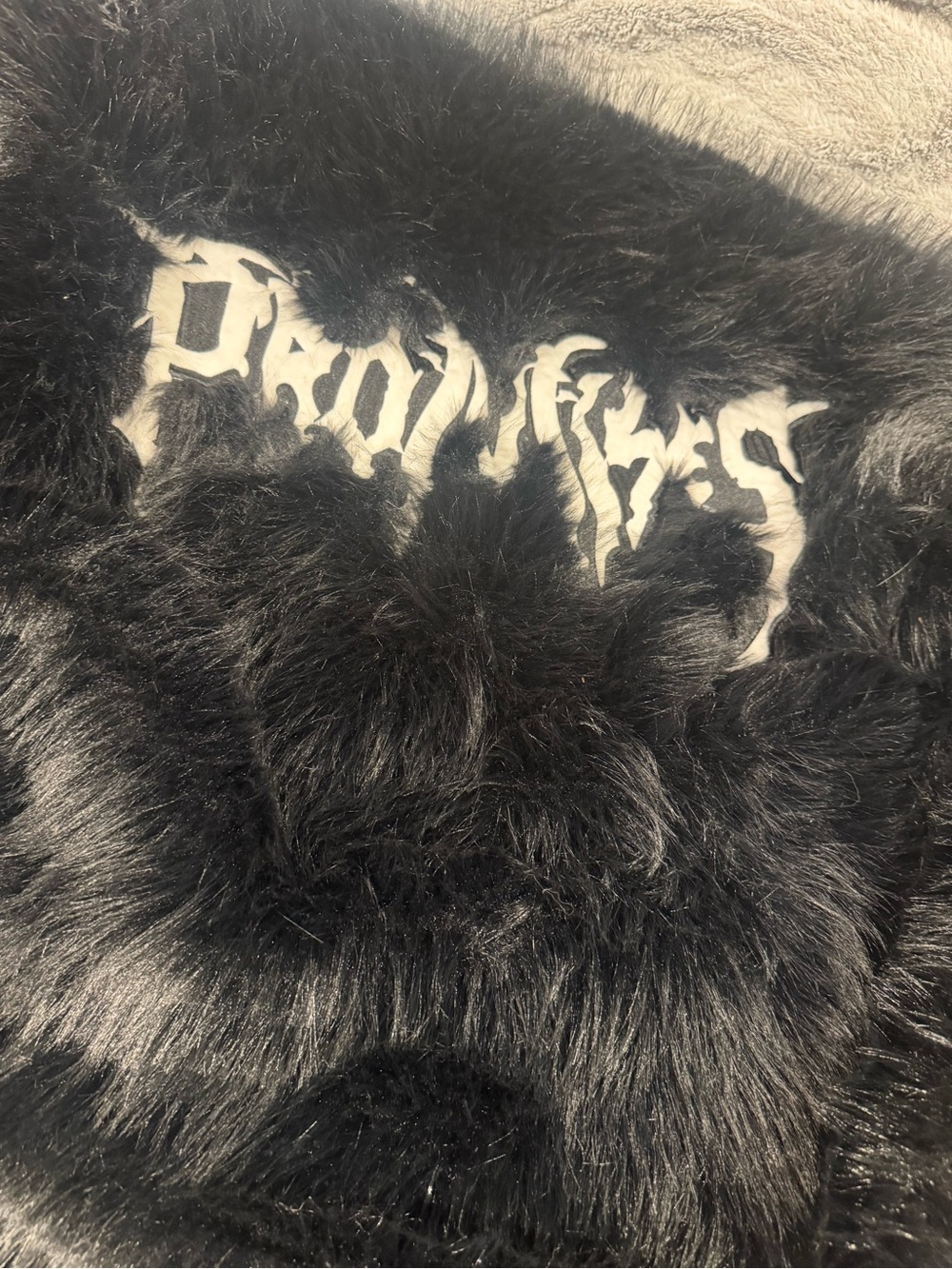 Black Faux Fur Women's Coat with White Script Detail